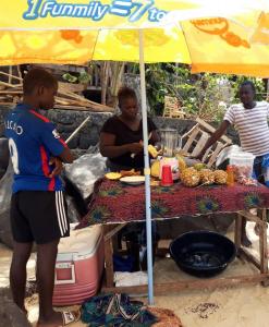 Pineapple and mango smoothies being prepared at the beach