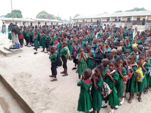 Praying lined up in assembly class 1 across to class 6 from right to left. BDEC New Gerihun Rd.
